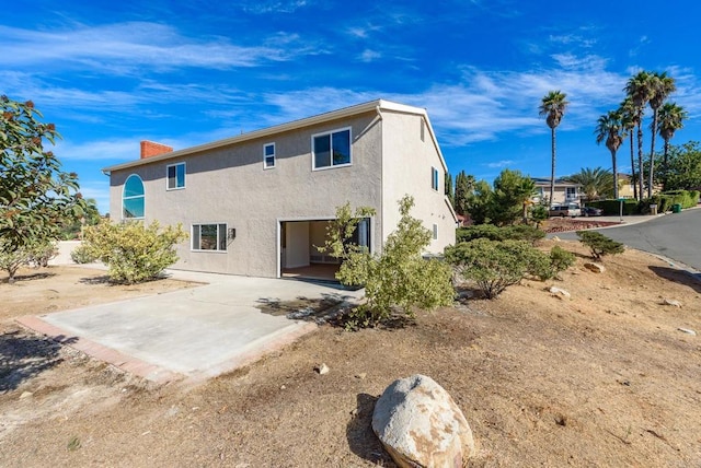 back of property featuring a patio area