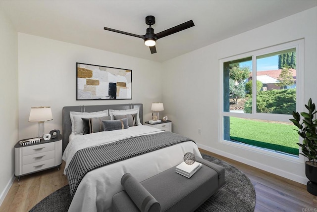 bedroom featuring wood-type flooring and ceiling fan