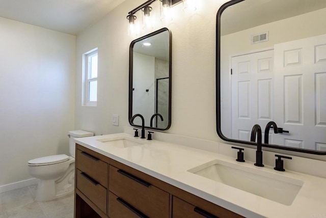 bathroom featuring vanity, toilet, tile patterned flooring, and an enclosed shower