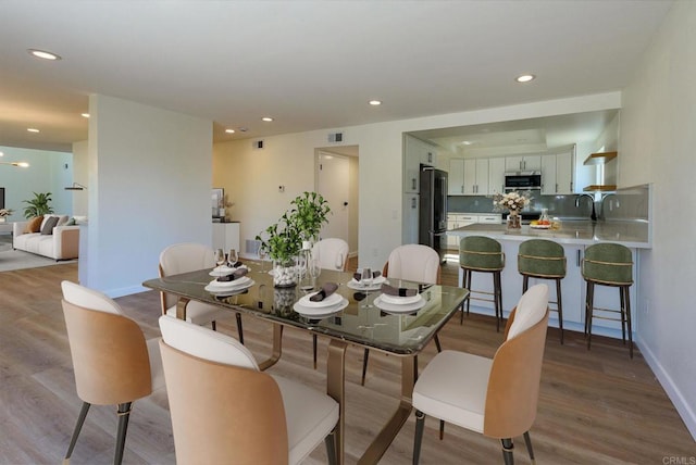 dining area featuring light hardwood / wood-style flooring