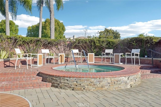 view of pool featuring a patio