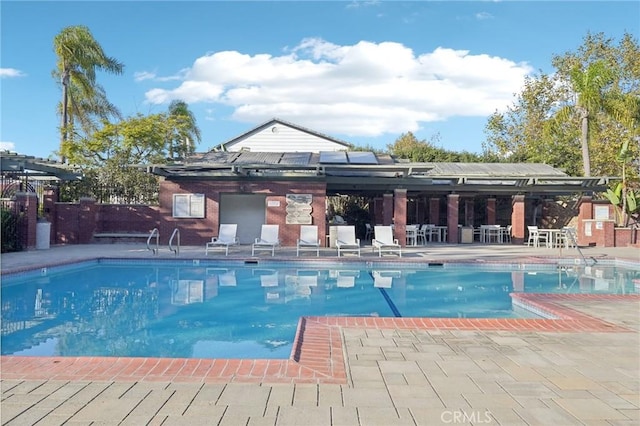 view of swimming pool with a patio