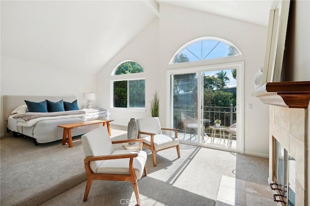 carpeted bedroom with a fireplace, access to outside, and high vaulted ceiling