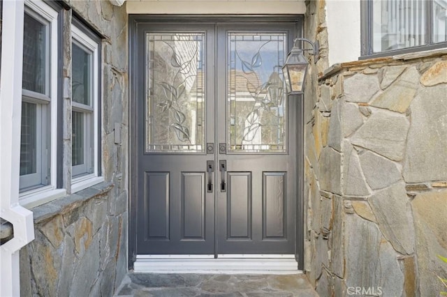 entrance to property featuring french doors