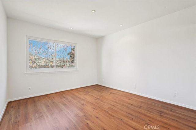 unfurnished room featuring wood-type flooring