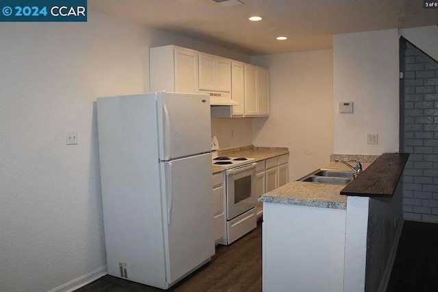 kitchen with dark hardwood / wood-style floors, extractor fan, sink, white cabinetry, and white appliances