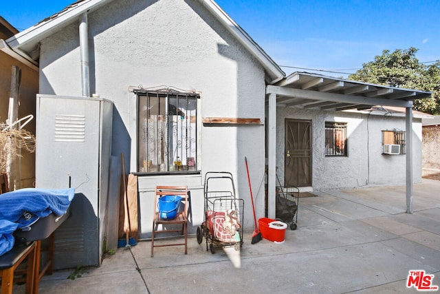 back of house with a patio area