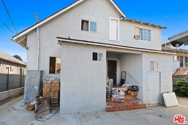 back of property featuring a patio area