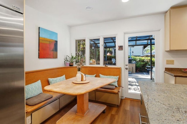 dining area featuring light wood-type flooring and breakfast area