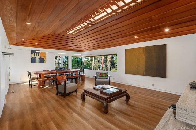 living room featuring vaulted ceiling, wood ceiling, and hardwood / wood-style floors