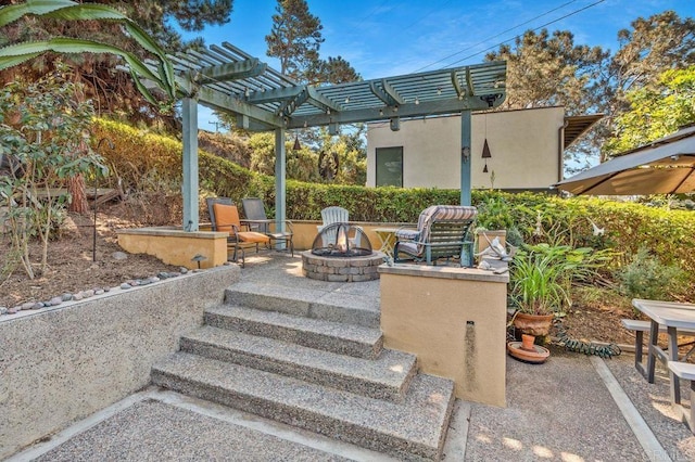 view of patio featuring an outdoor fire pit