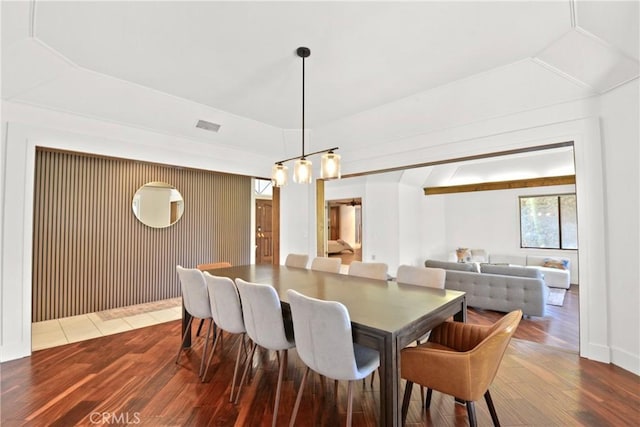 dining space with wood-type flooring