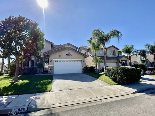 view of front of property with a garage and a front yard