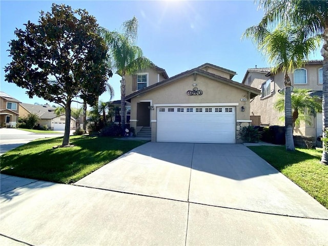 view of front of house featuring a front yard and a garage