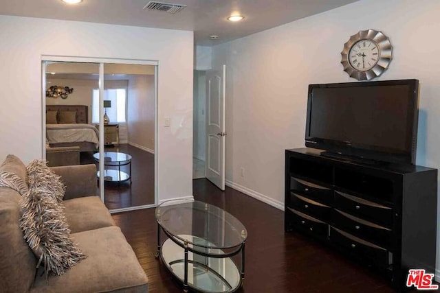 living room featuring dark hardwood / wood-style floors