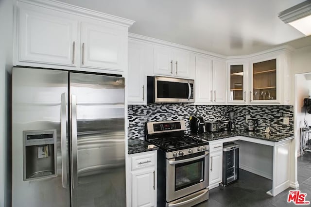 kitchen featuring wine cooler, stainless steel appliances, and white cabinetry