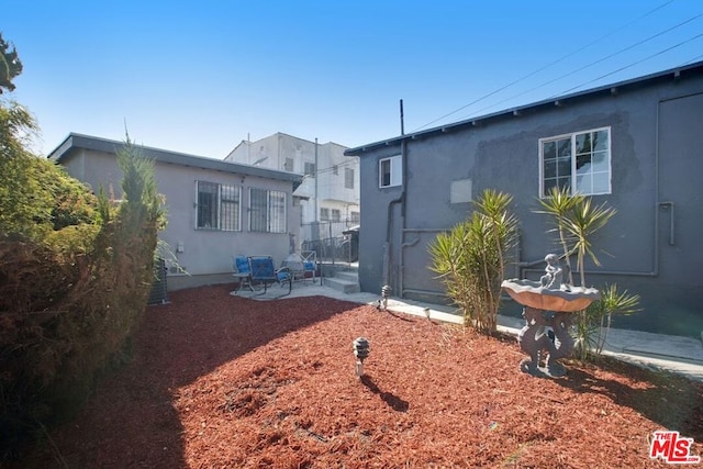 rear view of house featuring a patio area