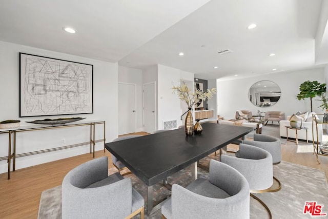 dining area featuring light wood-type flooring