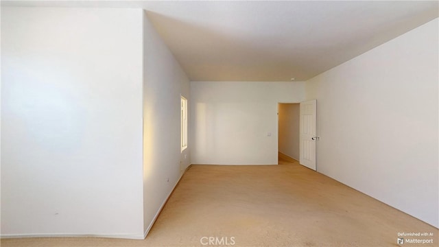 empty room featuring light colored carpet