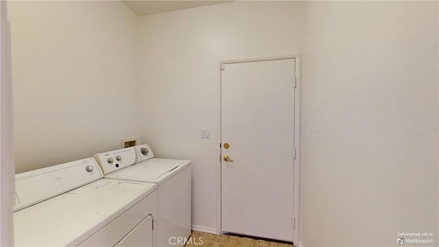 washroom with washer and dryer