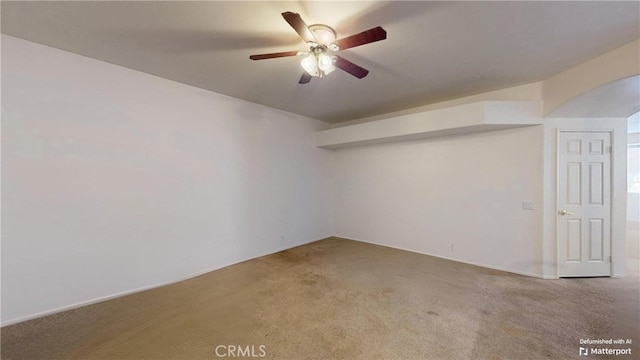 empty room with carpet floors and ceiling fan