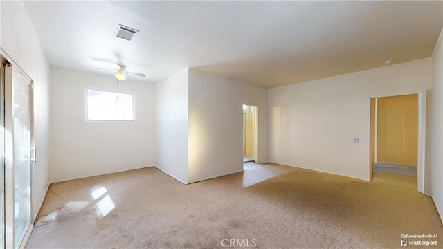 carpeted empty room with ceiling fan