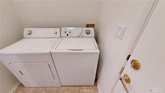 laundry room with separate washer and dryer