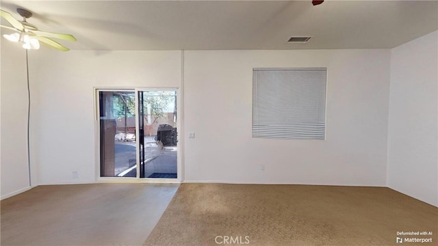 unfurnished room with carpet and ceiling fan