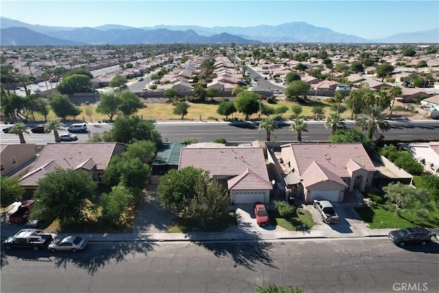 birds eye view of property with a mountain view