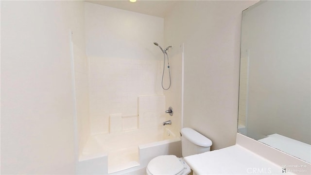 bathroom with shower / tub combination and toilet