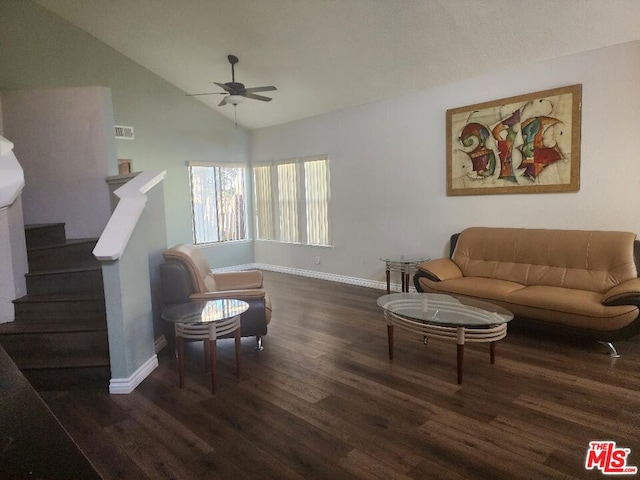 living room featuring lofted ceiling, ceiling fan, and dark hardwood / wood-style flooring