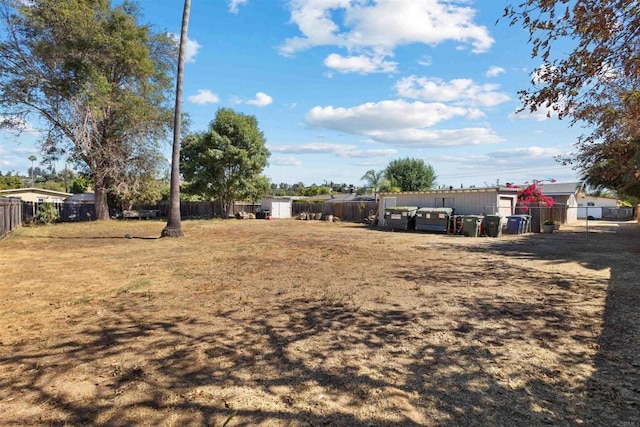 view of yard featuring a storage unit