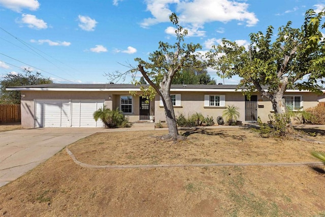 single story home featuring a garage