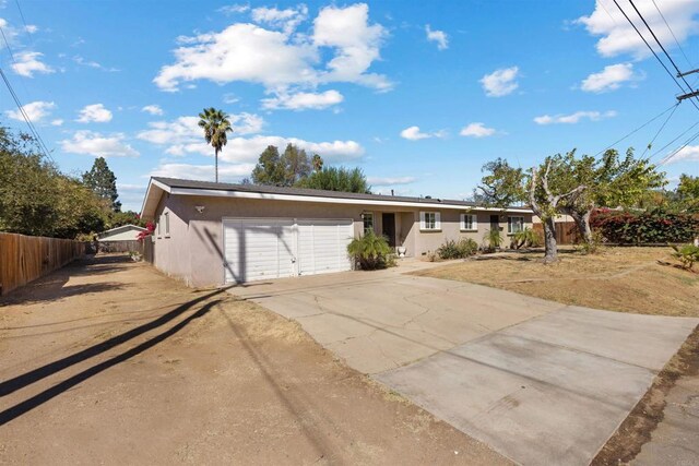 ranch-style home featuring a garage