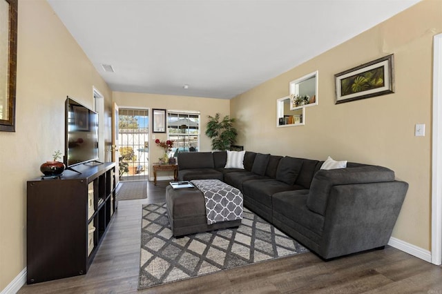 living room featuring dark wood-type flooring