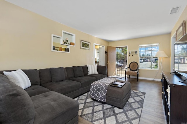 living room with light hardwood / wood-style flooring