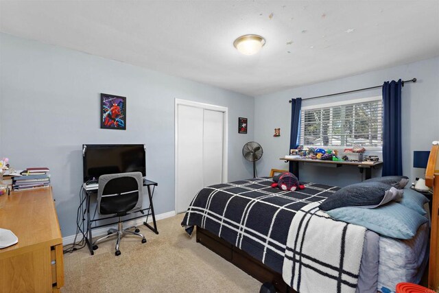 carpeted bedroom with a closet