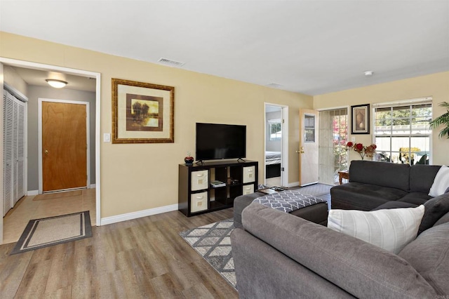 living room with light hardwood / wood-style floors