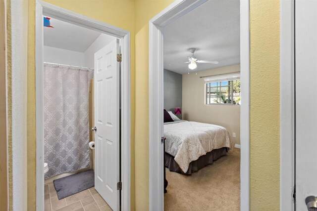 carpeted bedroom featuring ceiling fan