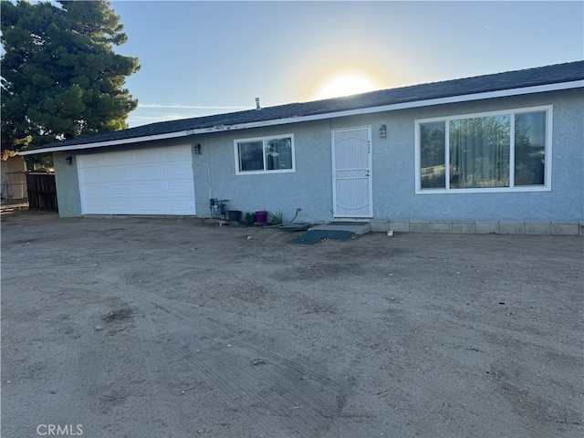 single story home with a garage