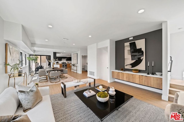 living room with light hardwood / wood-style floors