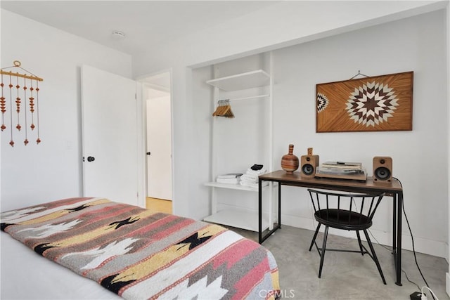 bedroom with concrete flooring