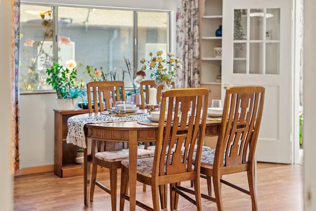 dining room with light wood-type flooring