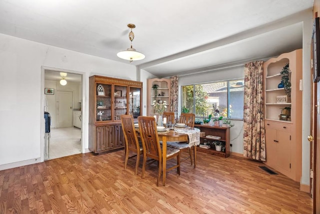 dining room featuring light hardwood / wood-style floors