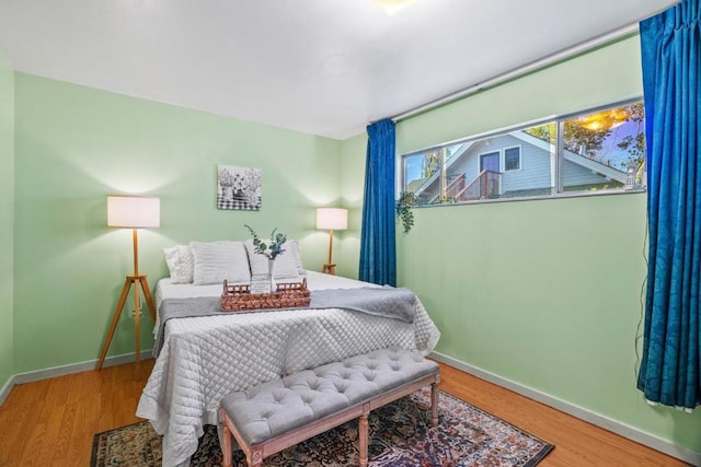 bedroom with wood-type flooring