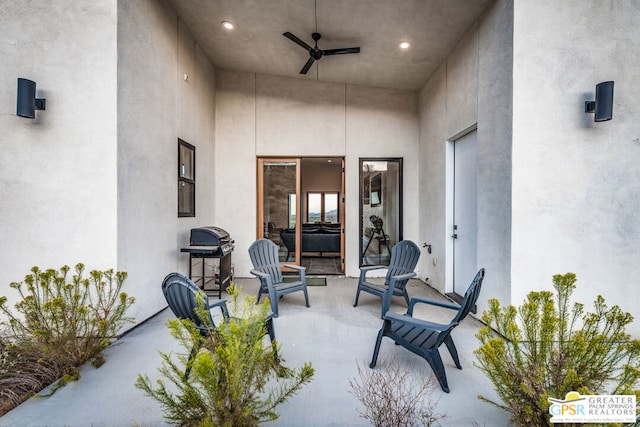 view of patio with ceiling fan and grilling area