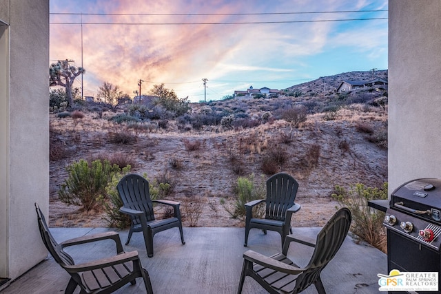 patio terrace at dusk with grilling area