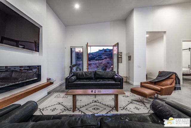 living room with high vaulted ceiling