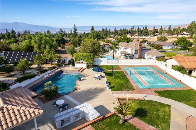 view of pool featuring a mountain view and a patio