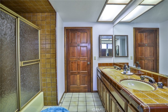 bathroom with tile patterned floors and vanity